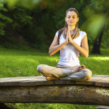 photo of girl meditating in nature