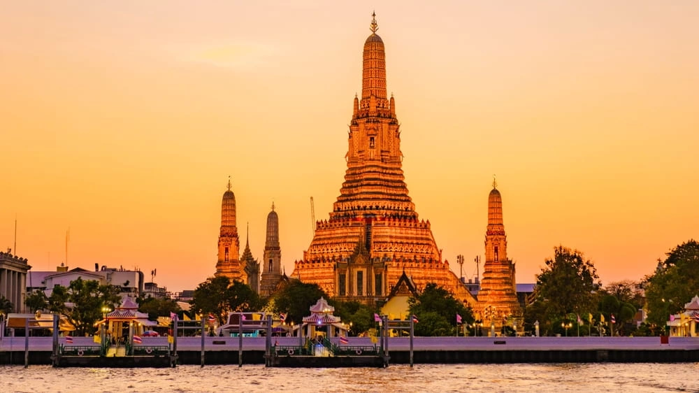 Admire Wat Arun by the Chao Phraya River
